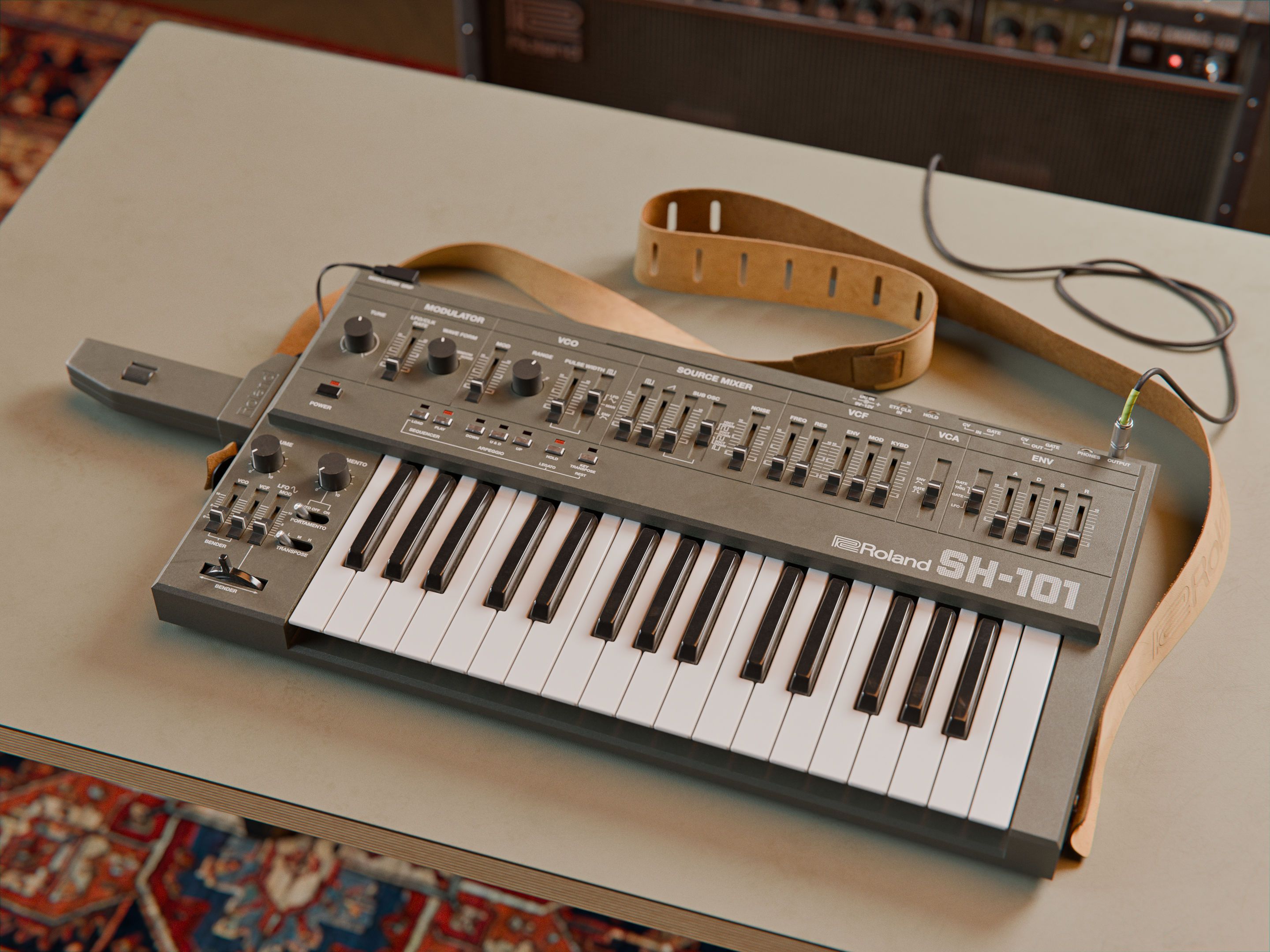 Roland SH-101 sitting on a table, viewed from the top, with modulation grip and shoulder strap attached.