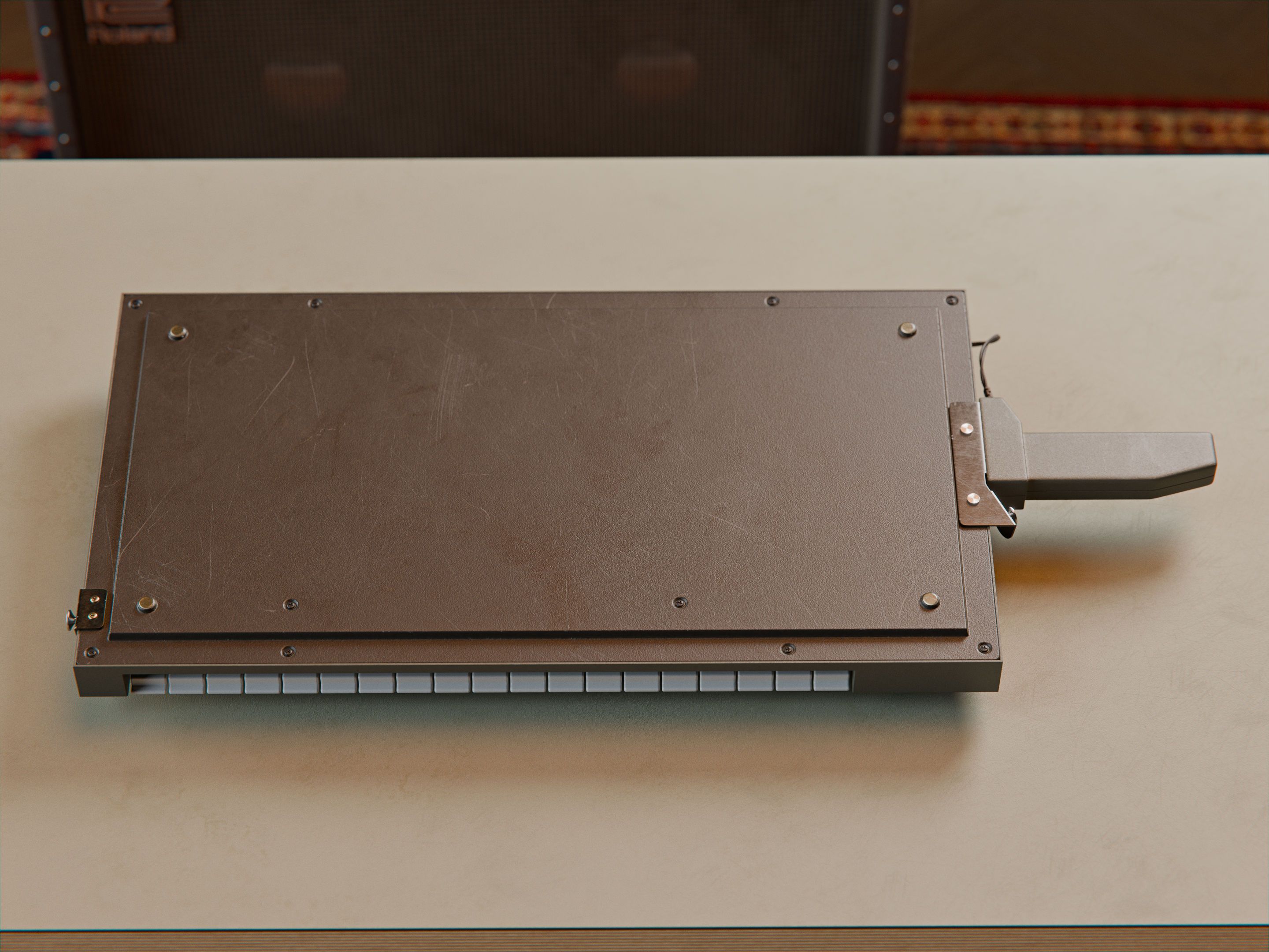 Top-down view of the bottom side of the Roland SH-101, on a table.